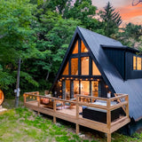 A-frame cabin exterior at dusk